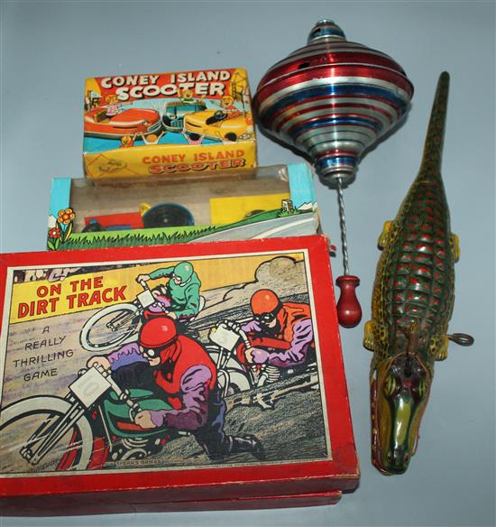 Tinplate toys to include boxers and a native riding a crocodile and other games
